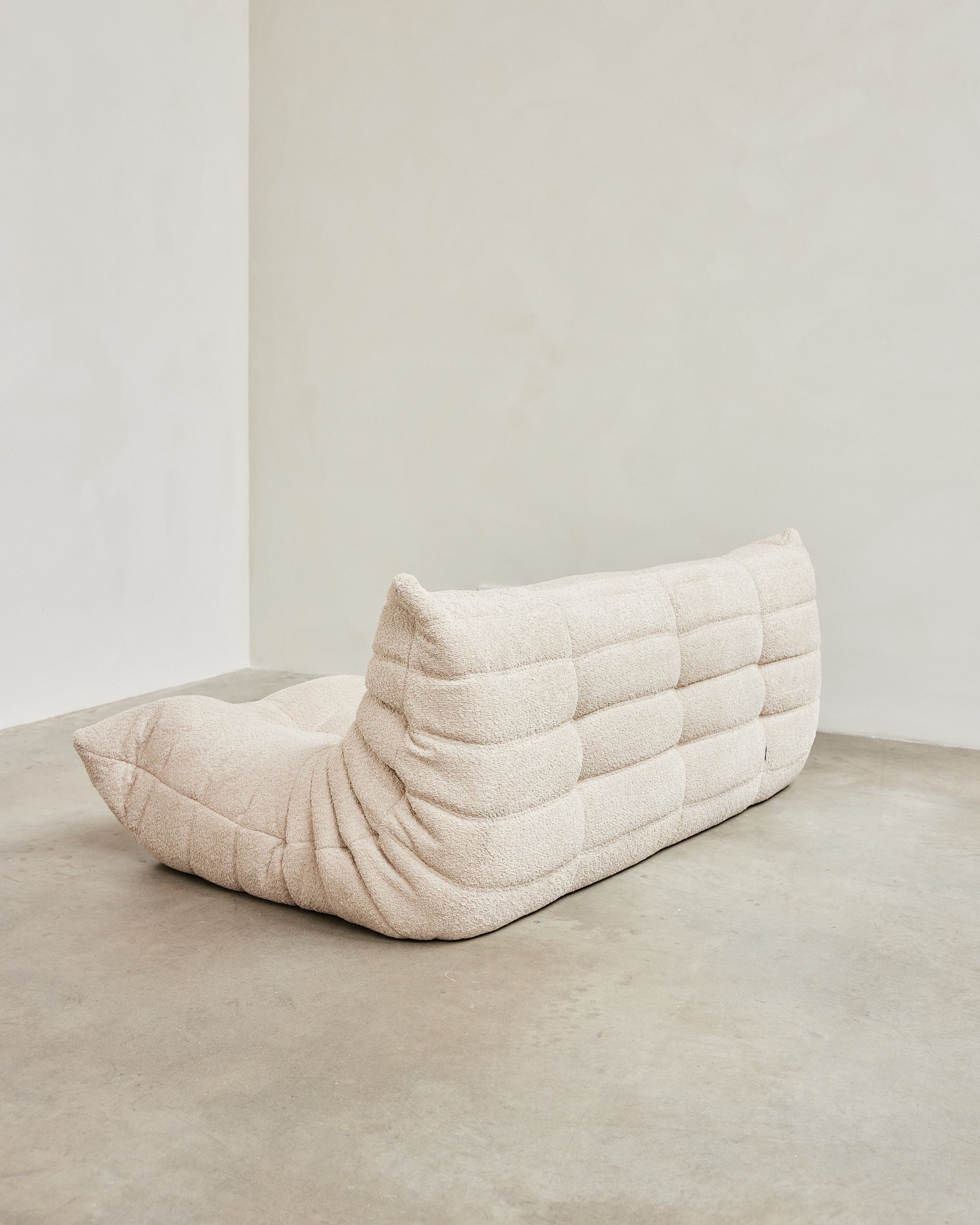 Ligne Roset Togo – three-seater white bouclé